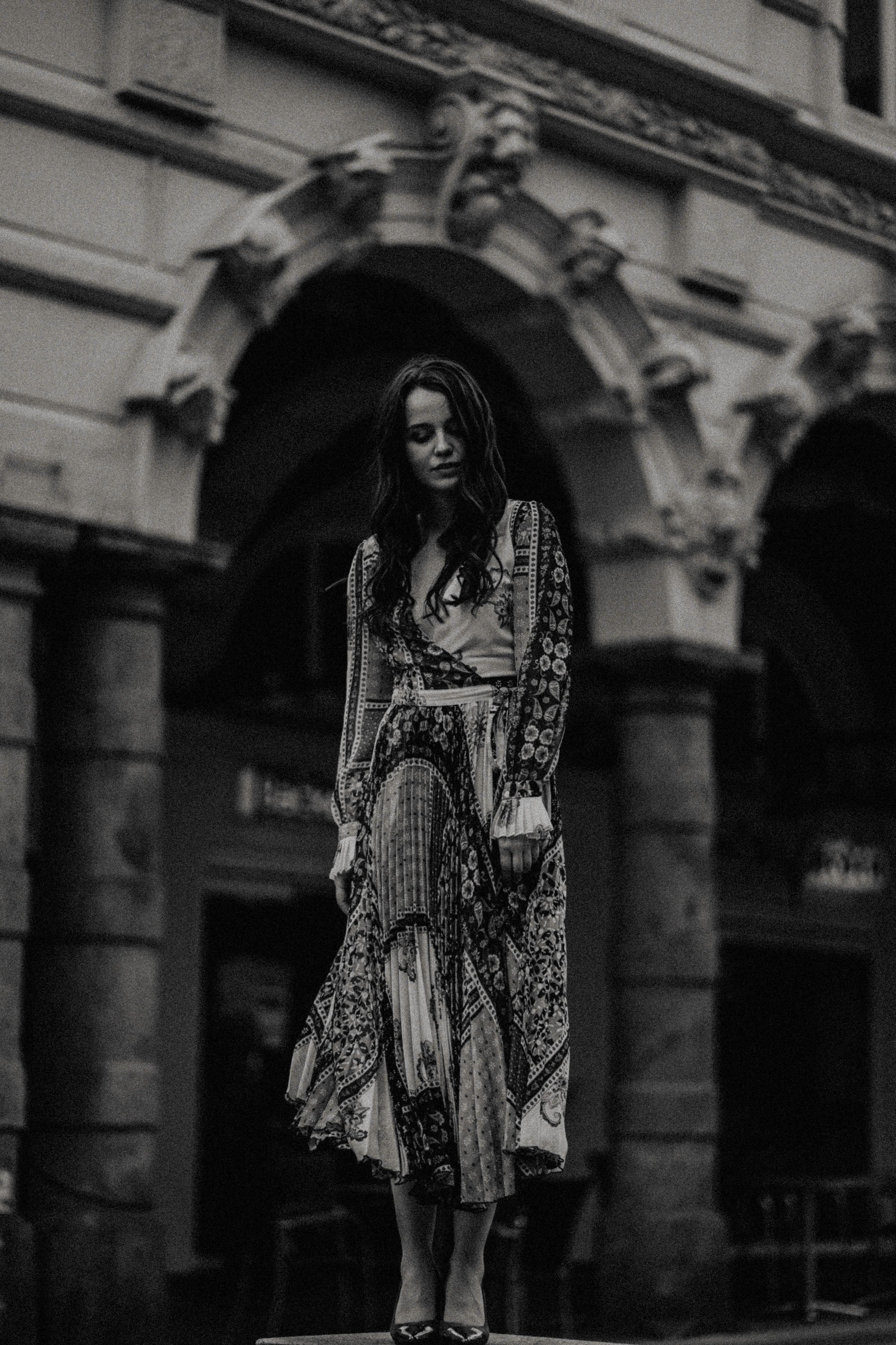 Woman wearing a monochrome patterned designer boho midi dress