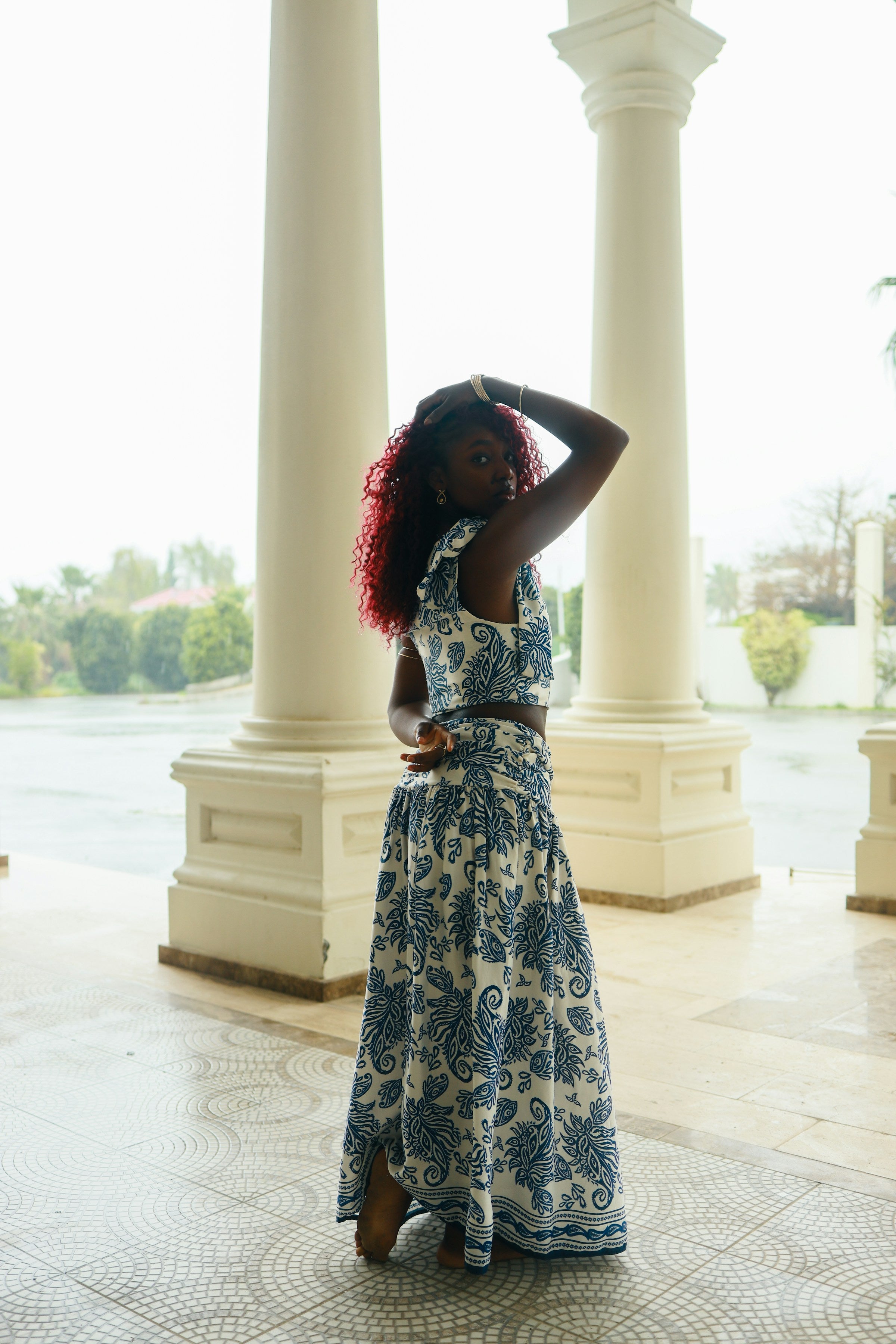 Woman wearing a blue patterned designer two-piece co-ord set